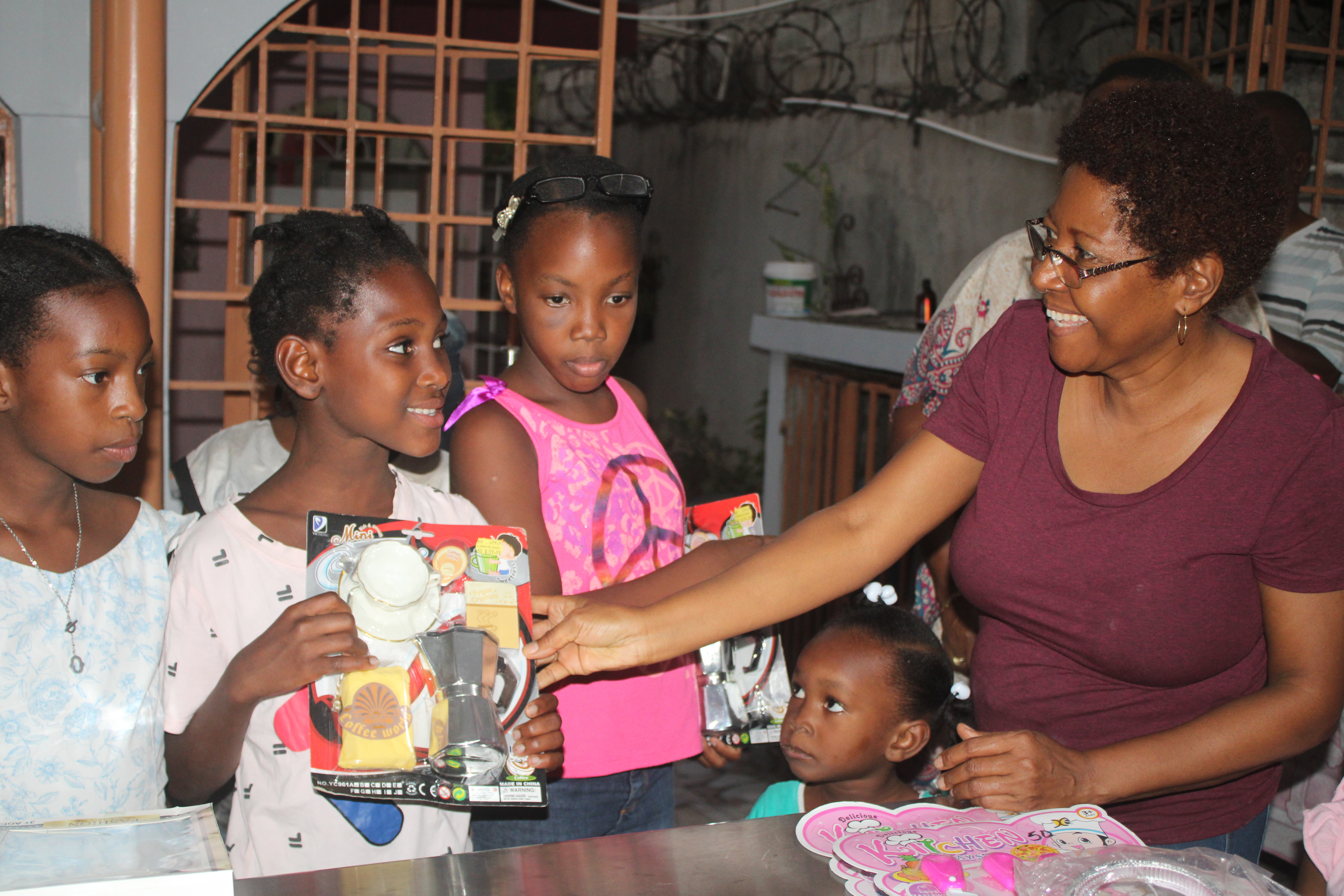 Volunteers handing out gift packages to community members